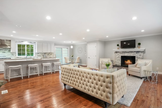 22 Fox Run, Wilton, CT 06897 - living room featuring light wood-type flooring, recessed lighting, ornamental molding, a fireplace, and baseboards