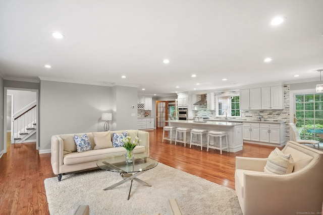 22 Fox Run, Wilton, CT 06897 - living room featuring crown molding, recessed lighting, stairs, light wood-style flooring, and baseboards