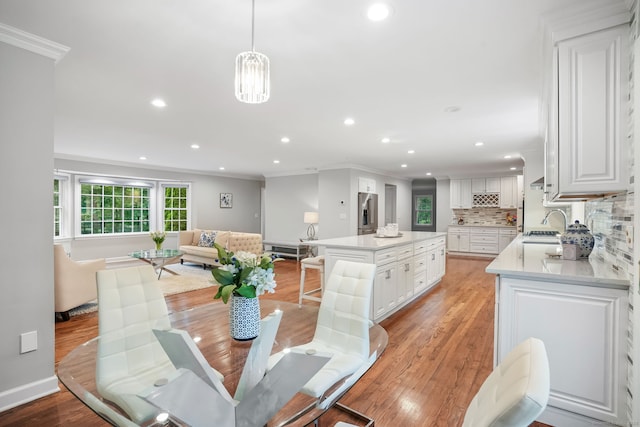 22 Fox Run, Wilton, CT 06897 - dining space featuring ornamental molding, light wood-style flooring, recessed lighting, and baseboards
