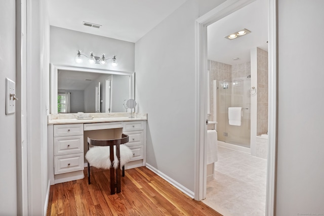 22 Fox Run, Wilton, CT 06897 - full bath featuring a shower stall, vanity, wood finished floors, and baseboards