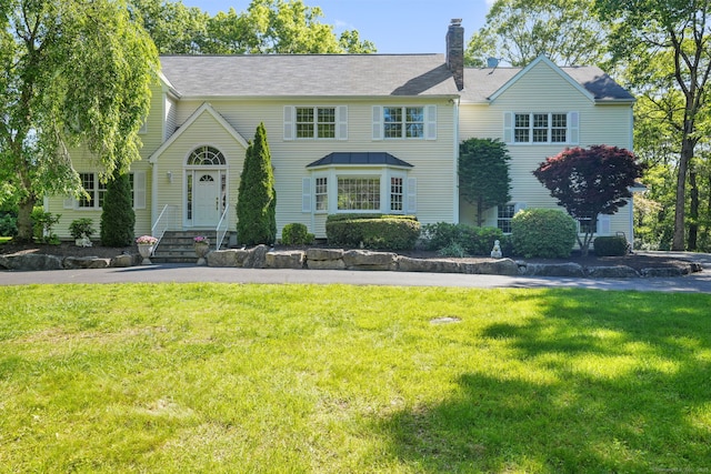 22 Fox Run, Wilton, CT 06897 - view of front of property featuring a chimney and a front yard