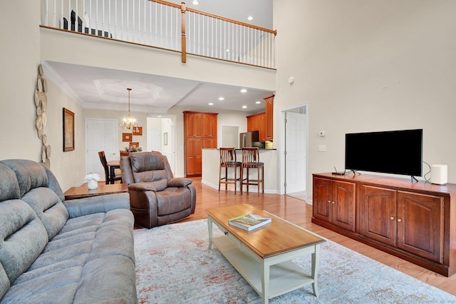 49 Bannan Ln Unit 49, Berlin, CT 06037 - living room featuring light wood-style floors, a chandelier, and recessed lighting