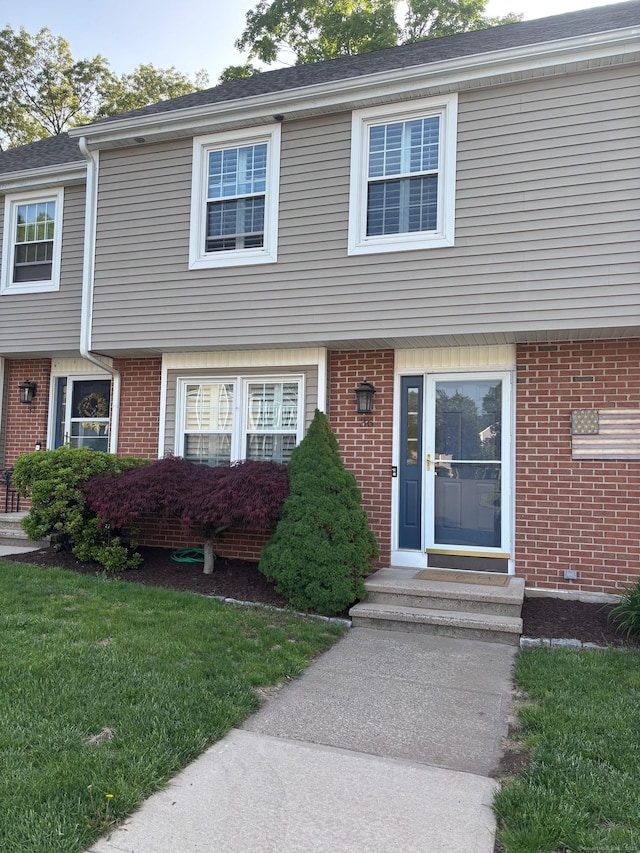 175 Berlin Ave Apt 36, Southington, CT 06489 - view of front of home featuring brick siding, entry steps, and a front lawn