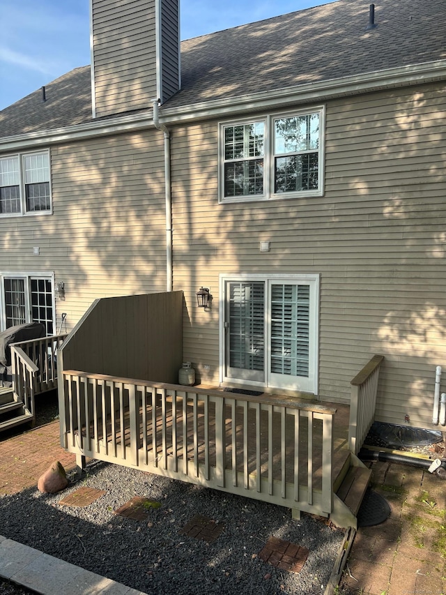 175 Berlin Ave Apt 36, Southington, CT 06489 - rear view of property with a chimney, a deck, and roof with shingles