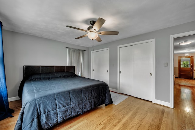 74 Belmont St, New Britain, CT 06053 - bedroom featuring multiple closets, light wood-style flooring, baseboards, and a ceiling fan