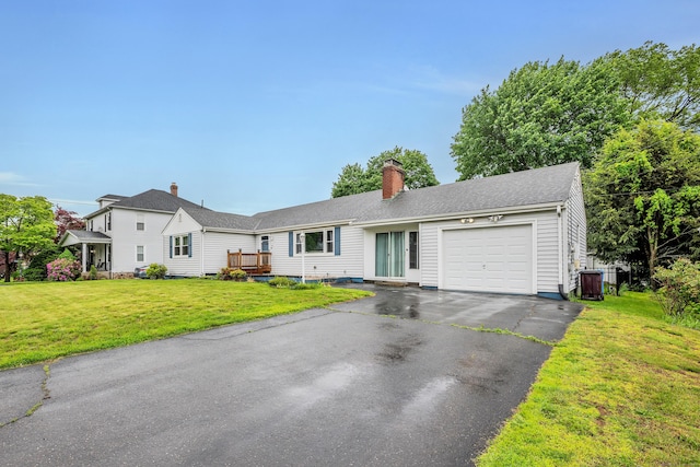 74 Belmont St, New Britain, CT 06053 - ranch-style home featuring a garage, driveway, a front yard, and a chimney