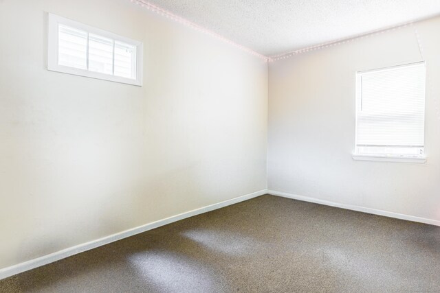 45 Kossuth St, New Haven, CT 06519 - carpeted empty room featuring a textured ceiling and baseboards