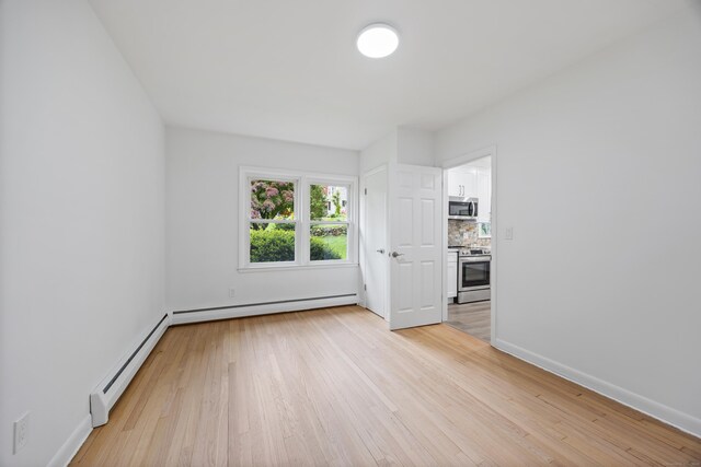 27 Hickory St, Plymouth, CT 06786 - unfurnished room with baseboard heating, light wood-type flooring, and baseboards