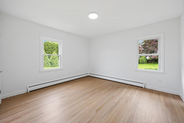 27 Hickory St, Plymouth, CT 06786 - spare room with light wood-style flooring, a baseboard heating unit, and baseboards