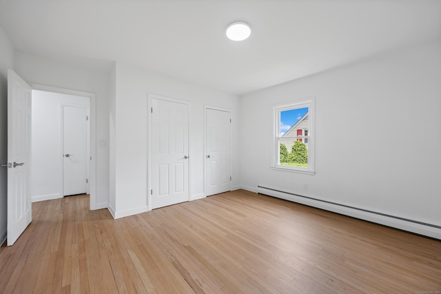27 Hickory St, Plymouth, CT 06786 - unfurnished bedroom with a baseboard radiator, light wood-style floors, and baseboards