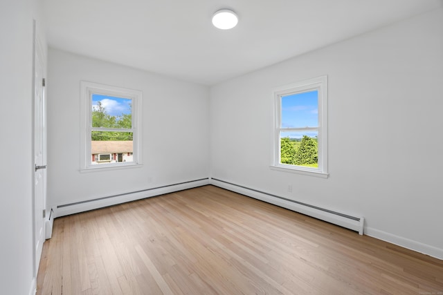 27 Hickory St, Plymouth, CT 06786 - unfurnished room with healthy amount of natural light, light wood-style floors, and baseboard heating