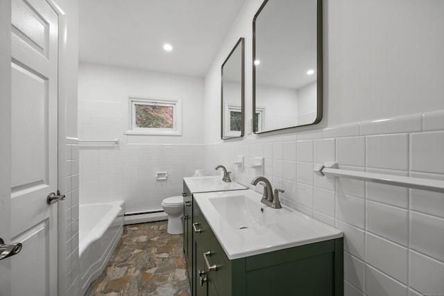 27 Hickory St, Plymouth, CT 06786 - full bathroom with baseboard heating, stone finish flooring, vanity, toilet, and a tub to relax in