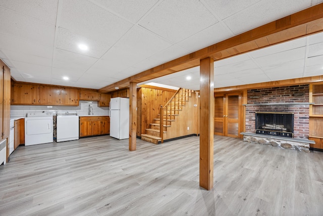 27 Hickory St, Plymouth, CT 06786 - kitchen featuring washer / clothes dryer, freestanding refrigerator, a sink, brown cabinetry, and a paneled ceiling