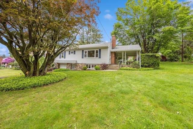 27 Hickory St, Plymouth, CT 06786 - split level home with a chimney, a front yard, and a porch