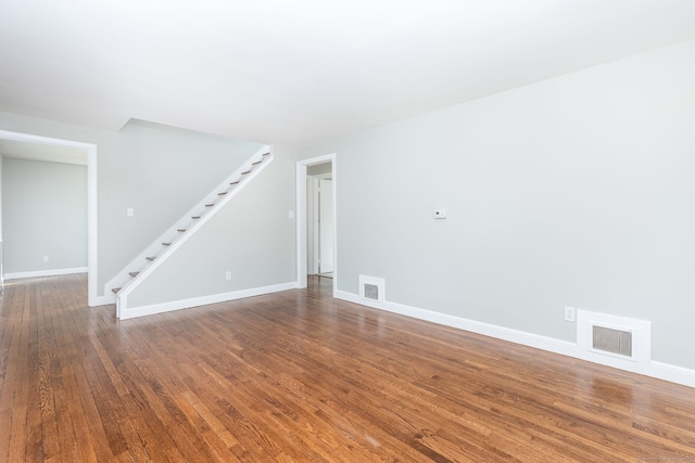 12 Pleasant Dr, Hamden, CT 06514 - empty room featuring stairway, wood finished floors, and baseboards