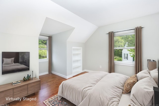 12 Pleasant Dr, Hamden, CT 06514 - bedroom with vaulted ceiling, wood finished floors, and baseboards