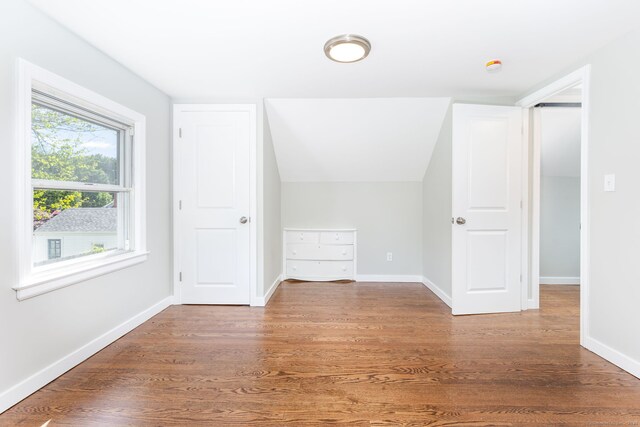 12 Pleasant Dr, Hamden, CT 06514 - additional living space featuring wood finished floors, baseboards, and lofted ceiling