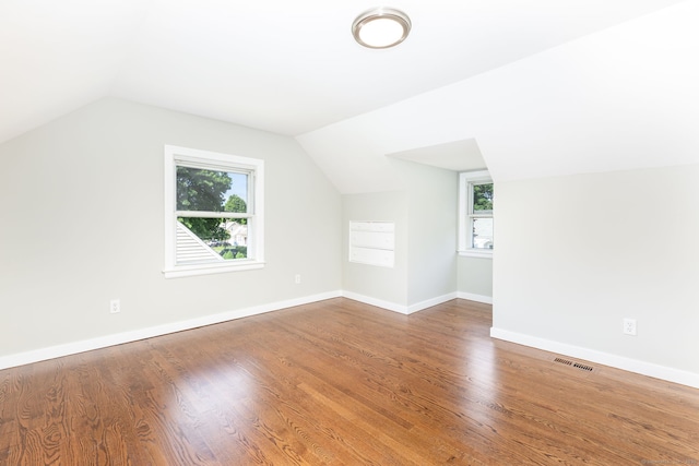 12 Pleasant Dr, Hamden, CT 06514 - bonus room with plenty of natural light, vaulted ceiling, wood finished floors, and baseboards