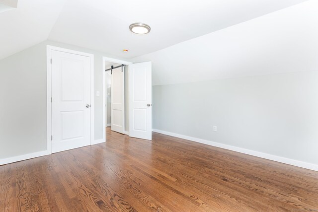 12 Pleasant Dr, Hamden, CT 06514 - bonus room featuring lofted ceiling, wood finished floors, and baseboards