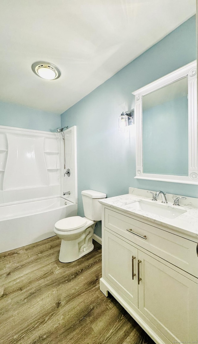 57 Quailcrest Rd, East Lyme, CT 06333 - full bath with wood finished floors, toilet, shower / tub combination, and vanity