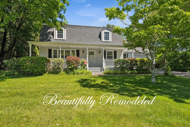 57 Quailcrest Rd, East Lyme, CT 06333 - view of front facade with a porch, roof with shingles, and a front lawn