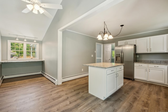 57 Quailcrest Rd, East Lyme, CT 06333 - kitchen with stainless steel fridge with ice dispenser, white cabinetry, dark wood-type flooring, light stone counters, and track lighting
