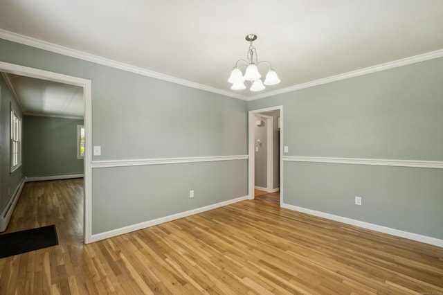 57 Quailcrest Rd, East Lyme, CT 06333 - unfurnished room with a chandelier, ornamental molding, baseboards, wood finished floors, and a baseboard radiator