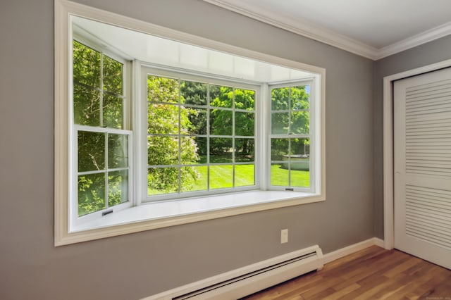 57 Quailcrest Rd, East Lyme, CT 06333 - unfurnished bedroom featuring wood finished floors, baseboards, a closet, ornamental molding, and a baseboard heating unit