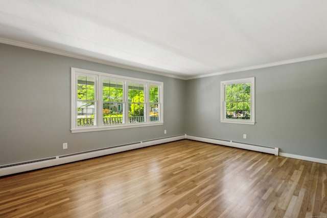 57 Quailcrest Rd, East Lyme, CT 06333 - unfurnished room featuring crown molding, healthy amount of natural light, a baseboard heating unit, wood finished floors, and baseboards