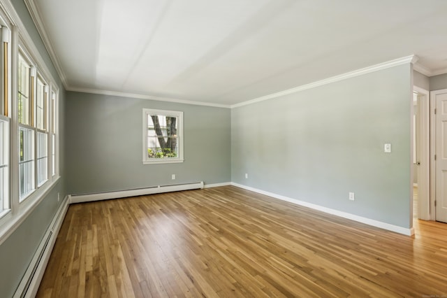 57 Quailcrest Rd, East Lyme, CT 06333 - unfurnished room featuring a baseboard heating unit, healthy amount of natural light, crown molding, and hardwood / wood-style flooring