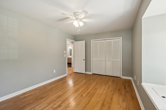 57 Quailcrest Rd, East Lyme, CT 06333 - unfurnished bedroom featuring a closet, baseboards, light wood-style flooring, and a ceiling fan