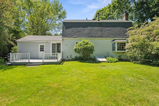 57 Quailcrest Rd, East Lyme, CT 06333 - rear view of property with a wooden deck, roof with shingles, and a lawn