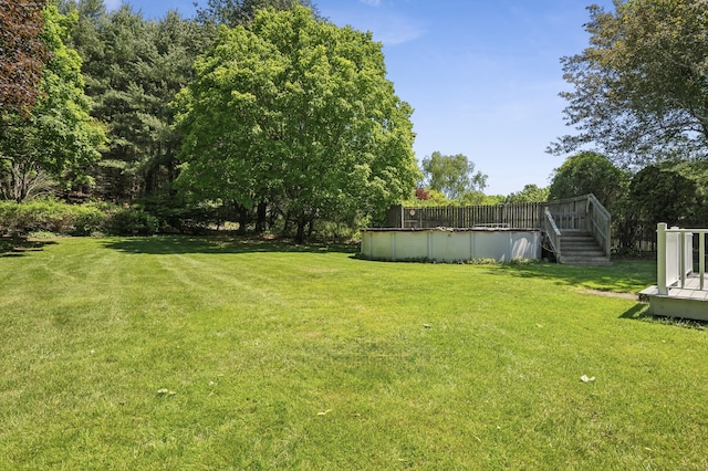 57 Quailcrest Rd, East Lyme, CT 06333 - view of grassy yard with a covered pool, a deck, and stairs