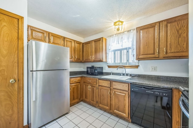 757 Lake Ave Apt 3, Bristol, CT 06010 - kitchen with black appliances, dark countertops, brown cabinetry, light tile patterned floors, and a textured ceiling