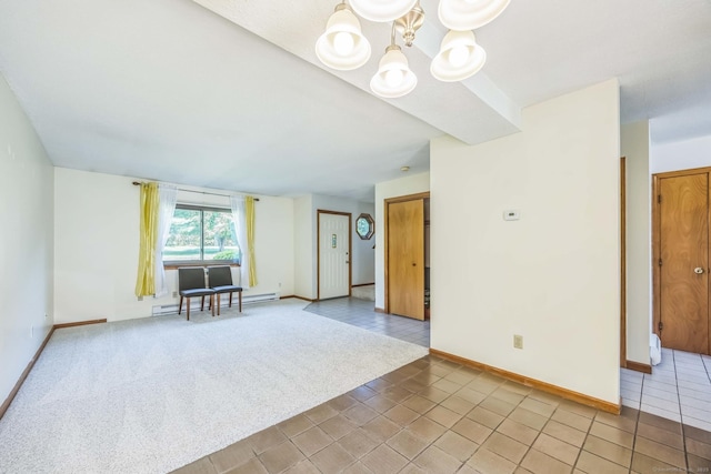 757 Lake Ave Apt 3, Bristol, CT 06010 - empty room with baseboard heating, a chandelier, and light tile patterned floors
