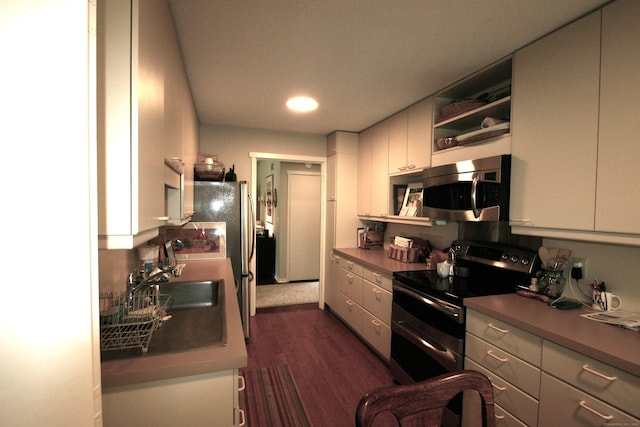 575A Village St, Southbury, CT 06488 - kitchen featuring stainless steel appliances, a sink, dark wood-style floors, white cabinetry, and open shelves
