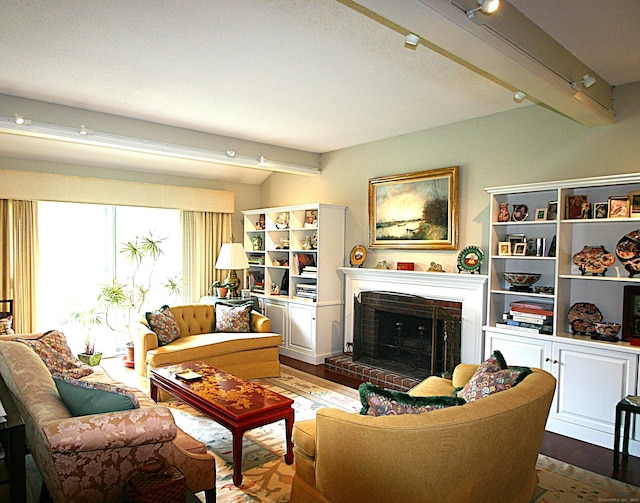 575A Village St, Southbury, CT 06488 - living room featuring beam ceiling, a fireplace, and wood finished floors
