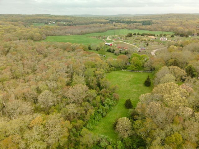 aerial overview of property's location featuring a heavily wooded area and rural landscape