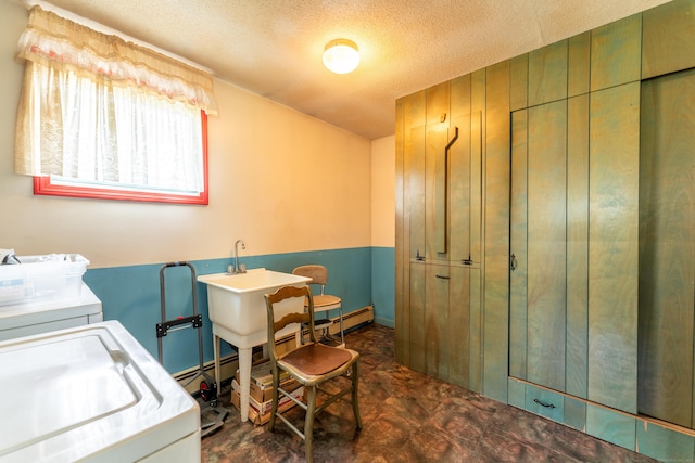 laundry area featuring washing machine and dryer and a textured ceiling