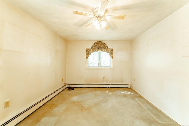 carpeted spare room with baseboard heating and ceiling fan