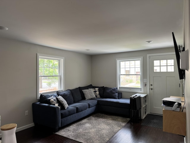 14 Russell St, Hamden, CT 06517 - living room featuring dark wood-style flooring and baseboards