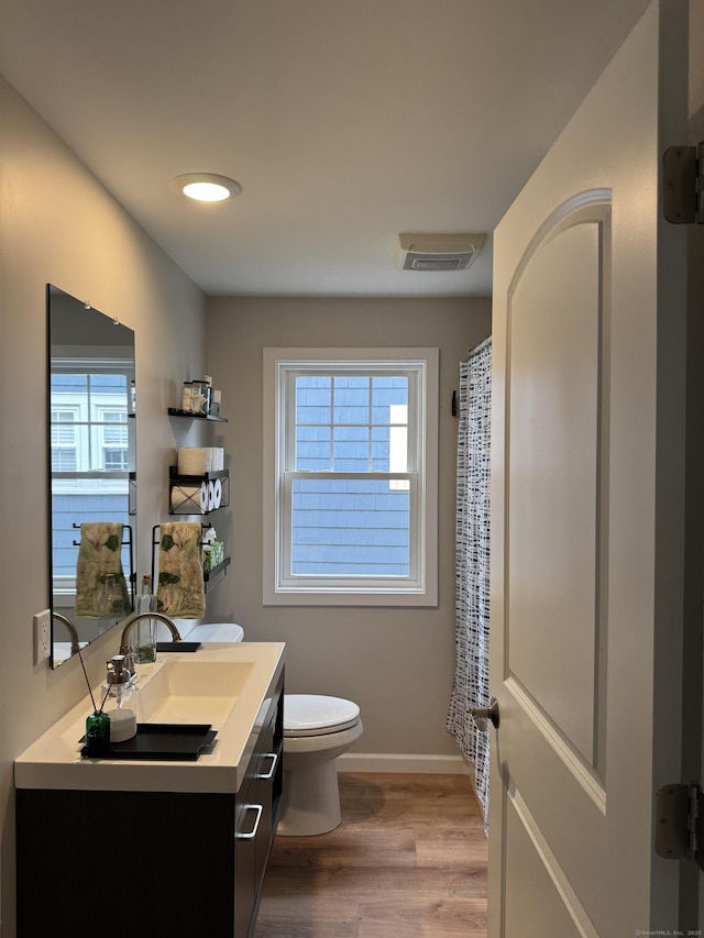 14 Russell St, Hamden, CT 06517 - full bathroom featuring vanity, plenty of natural light, wood finished floors, and curtained shower