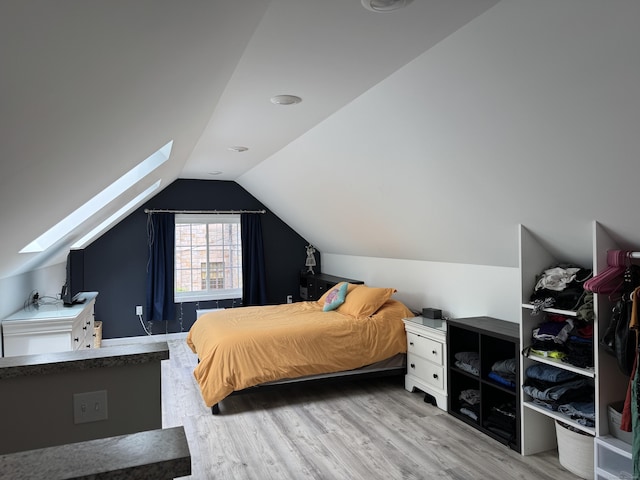 14 Russell St, Hamden, CT 06517 - bedroom featuring a skylight, wood finished floors, and vaulted ceiling