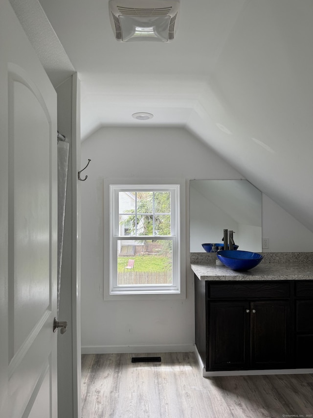 14 Russell St, Hamden, CT 06517 - bathroom featuring vaulted ceiling, vanity, and wood finished floors