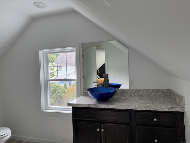 14 Russell St, Hamden, CT 06517 - bathroom with vanity, vaulted ceiling, and wood finished floors
