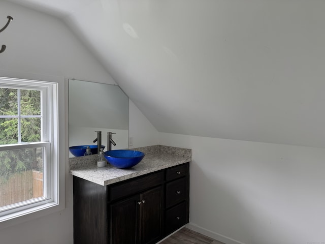 14 Russell St, Hamden, CT 06517 - bathroom featuring vaulted ceiling, vanity, and wood finished floors