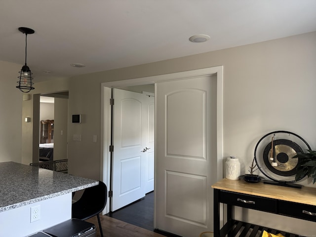 14 Russell St, Hamden, CT 06517 - kitchen with dark wood-style flooring, hanging light fixtures, and light stone countertops