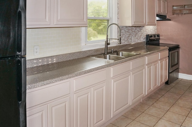 3 Fielding Dr, Montville, CT 06382 - kitchen featuring freestanding refrigerator, stainless steel range with electric cooktop, a sink, under cabinet range hood, and light tile patterned floors