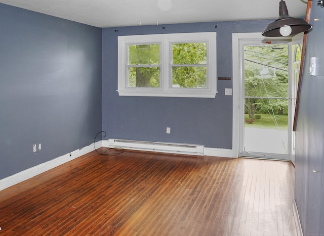 3 Fielding Dr, Montville, CT 06382 - empty room featuring a baseboard heating unit, baseboards, and wood-type flooring