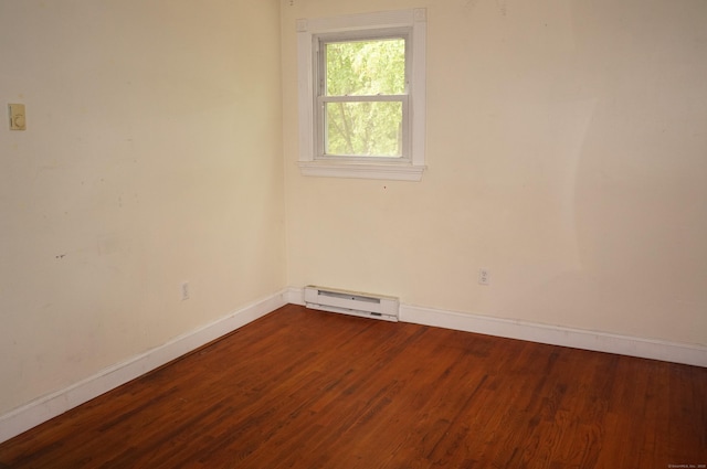 3 Fielding Dr, Montville, CT 06382 - empty room with a baseboard heating unit, baseboards, and dark wood-type flooring